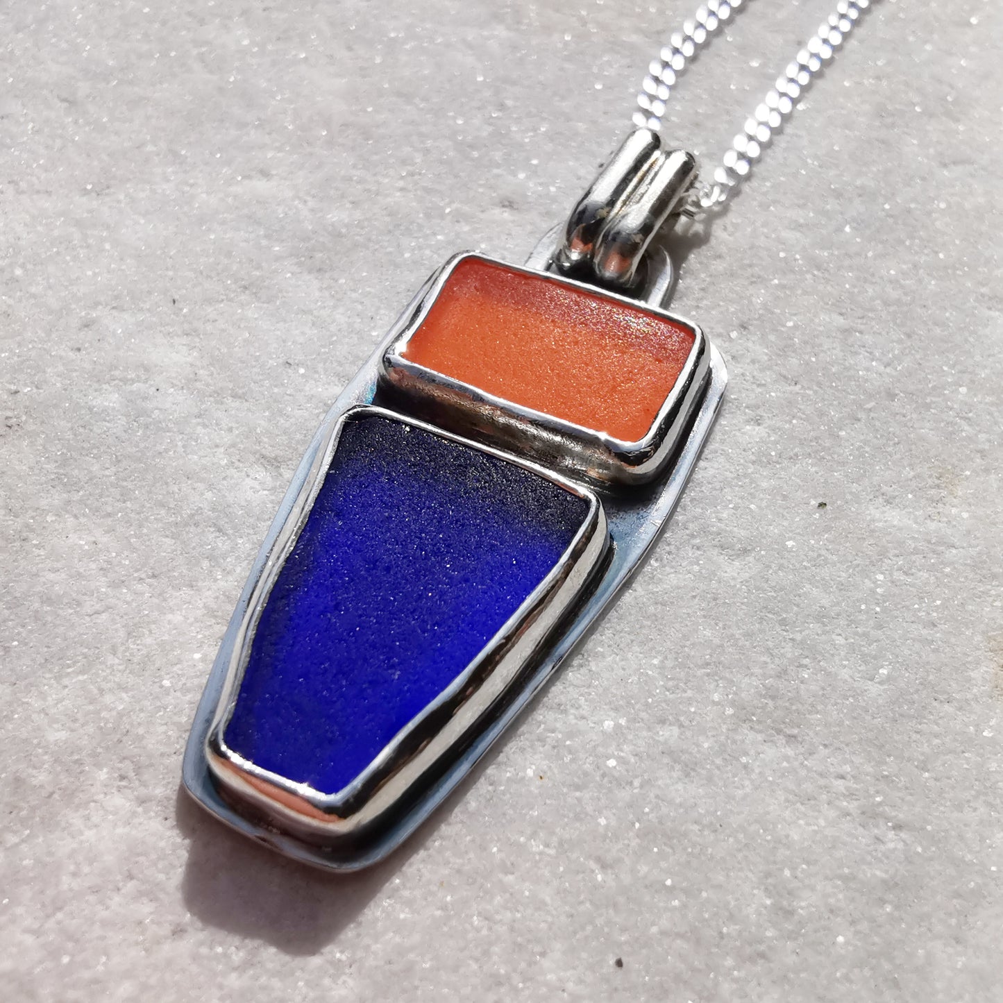 Scottish orange and blue sea glass & sterling silver pendant.