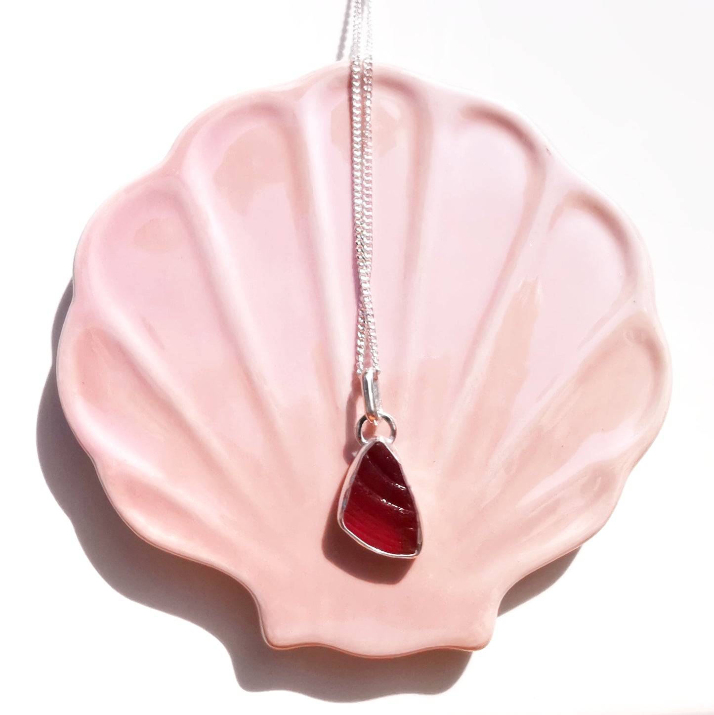 Red amberina UV sea glass & sterling silver pendant