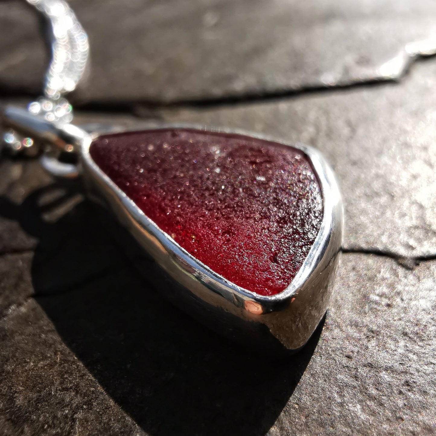 Red amberina UV sea glass & sterling silver pendant