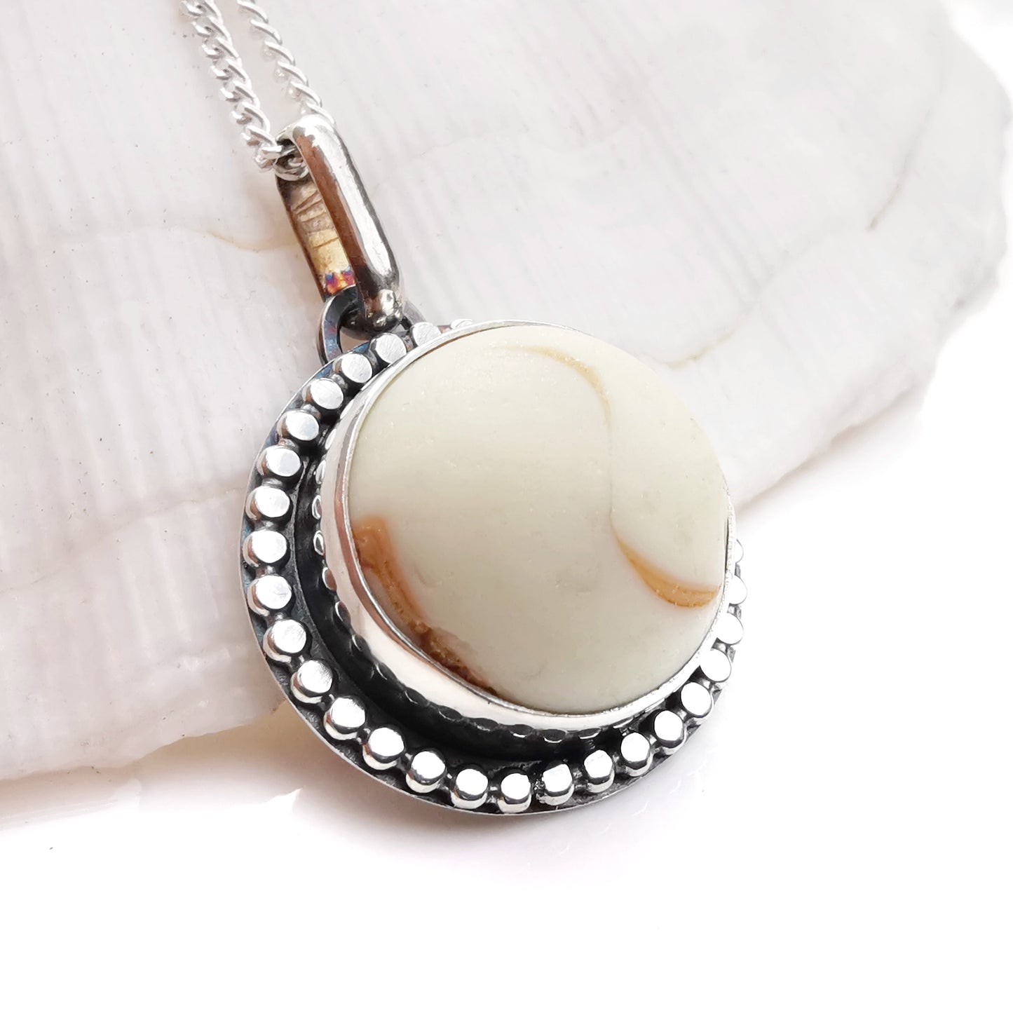 Scottish off white UV partial sea glass marble & sterling silver pendant.