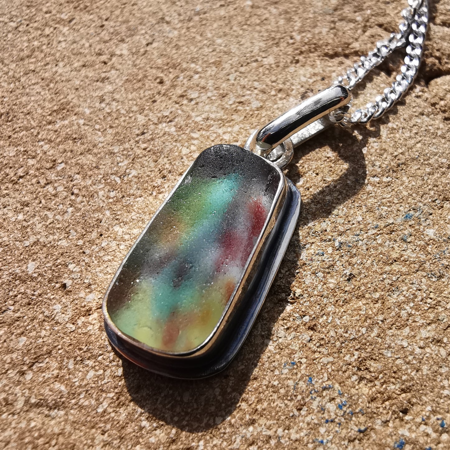 Scottish multi coloured sea glass & sterling silver pendant.