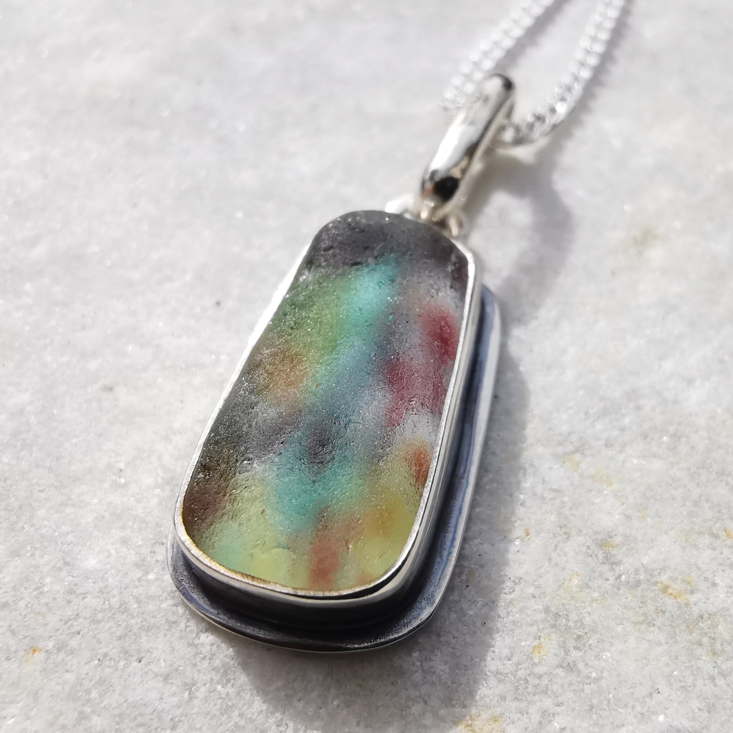 Scottish multi coloured sea glass & sterling silver pendant.