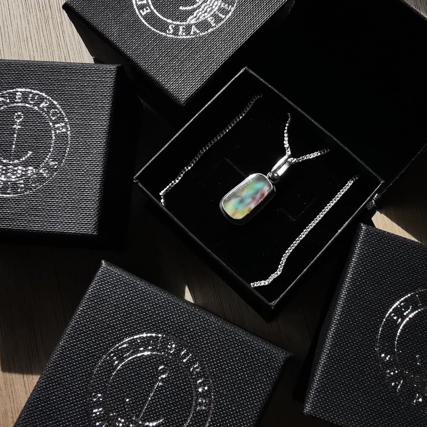 Scottish multi coloured sea glass & sterling silver pendant.