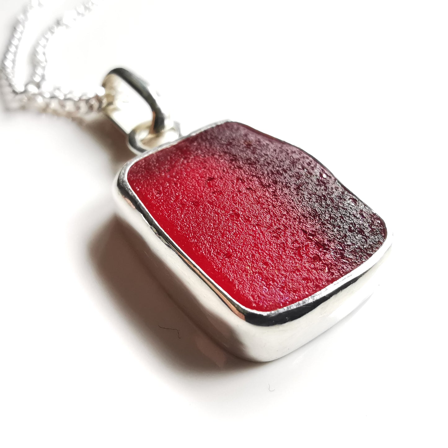 Scottish red UV sea glass & sterling silver pendant.