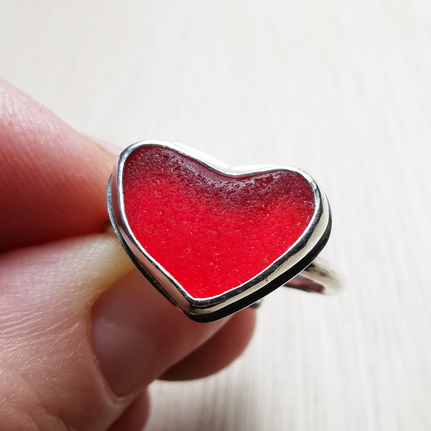 Red UV sea glass heart & sterling silver adjustable ring.