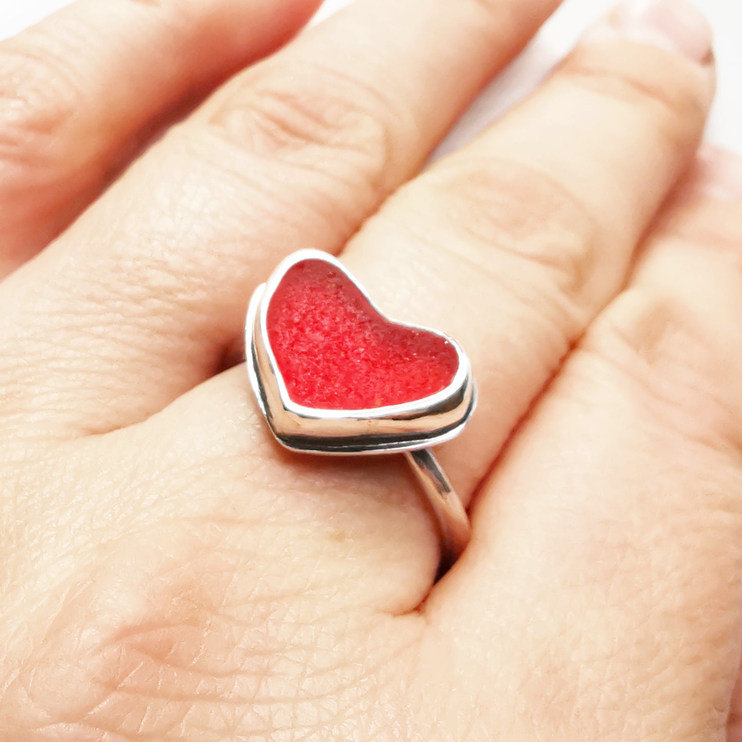 Red UV sea glass heart & sterling silver adjustable ring.