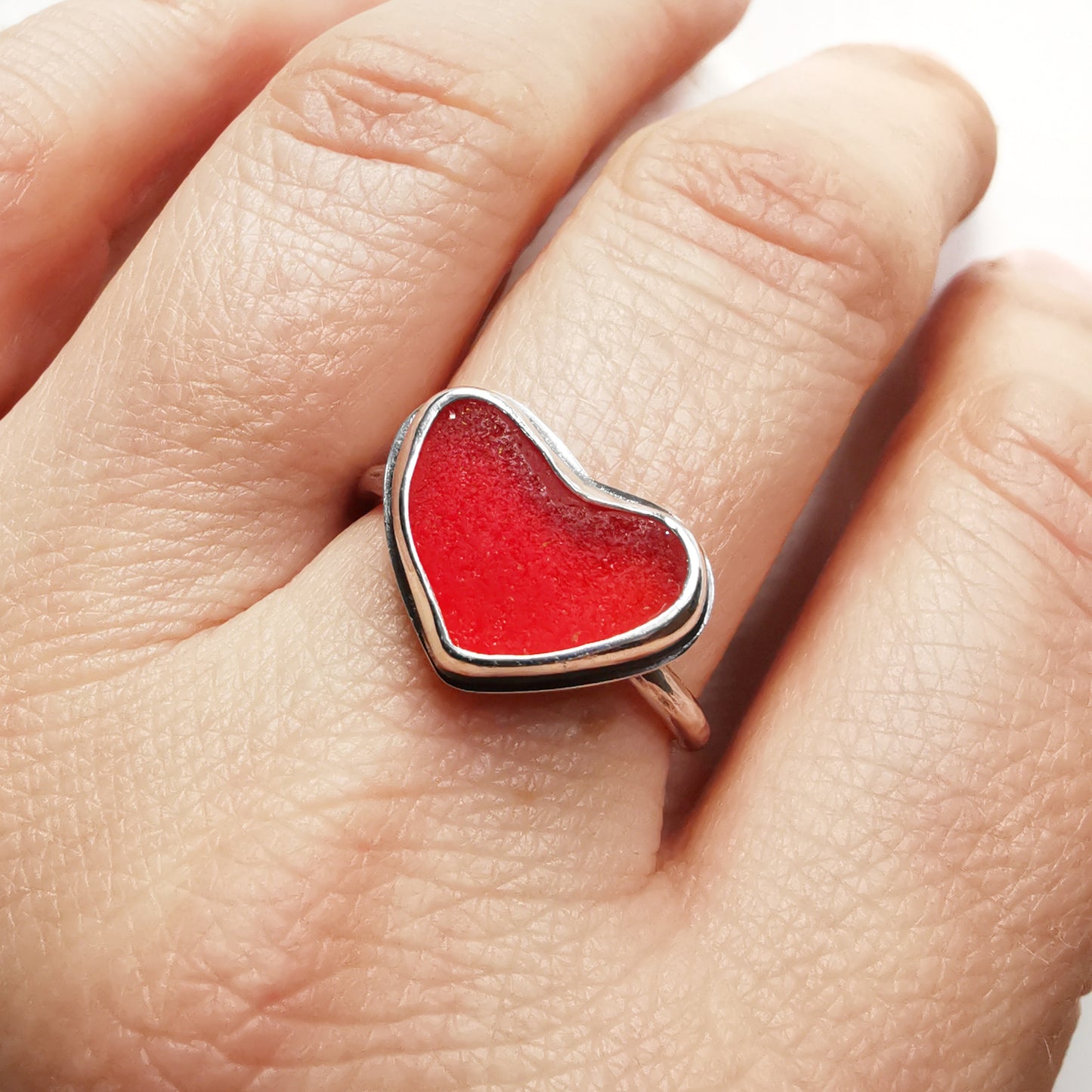 Red UV sea glass heart & sterling silver adjustable ring.