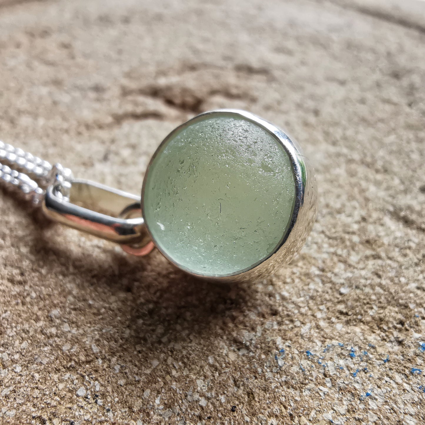 Genuine tiny Scottish Codd sea glass marble & sterling silver pendant.