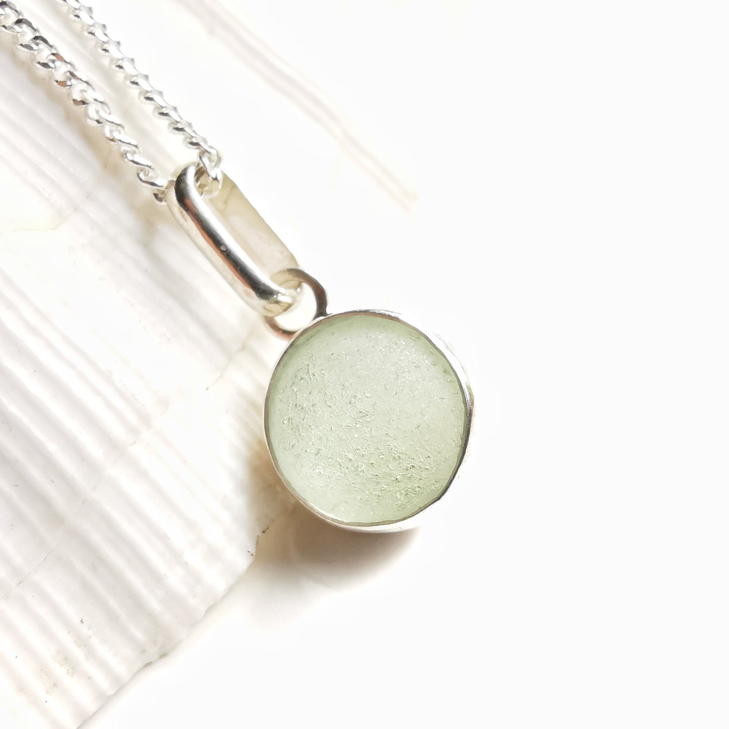 Genuine tiny Scottish Codd sea glass marble & sterling silver pendant.