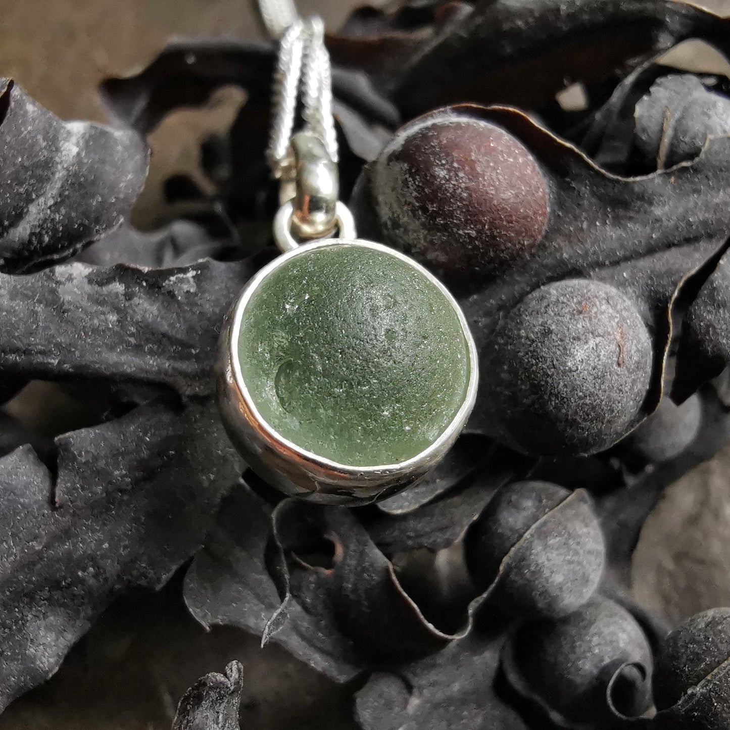 Genuine tiny Scottish Codd sea glass marble & sterling silver pendant.