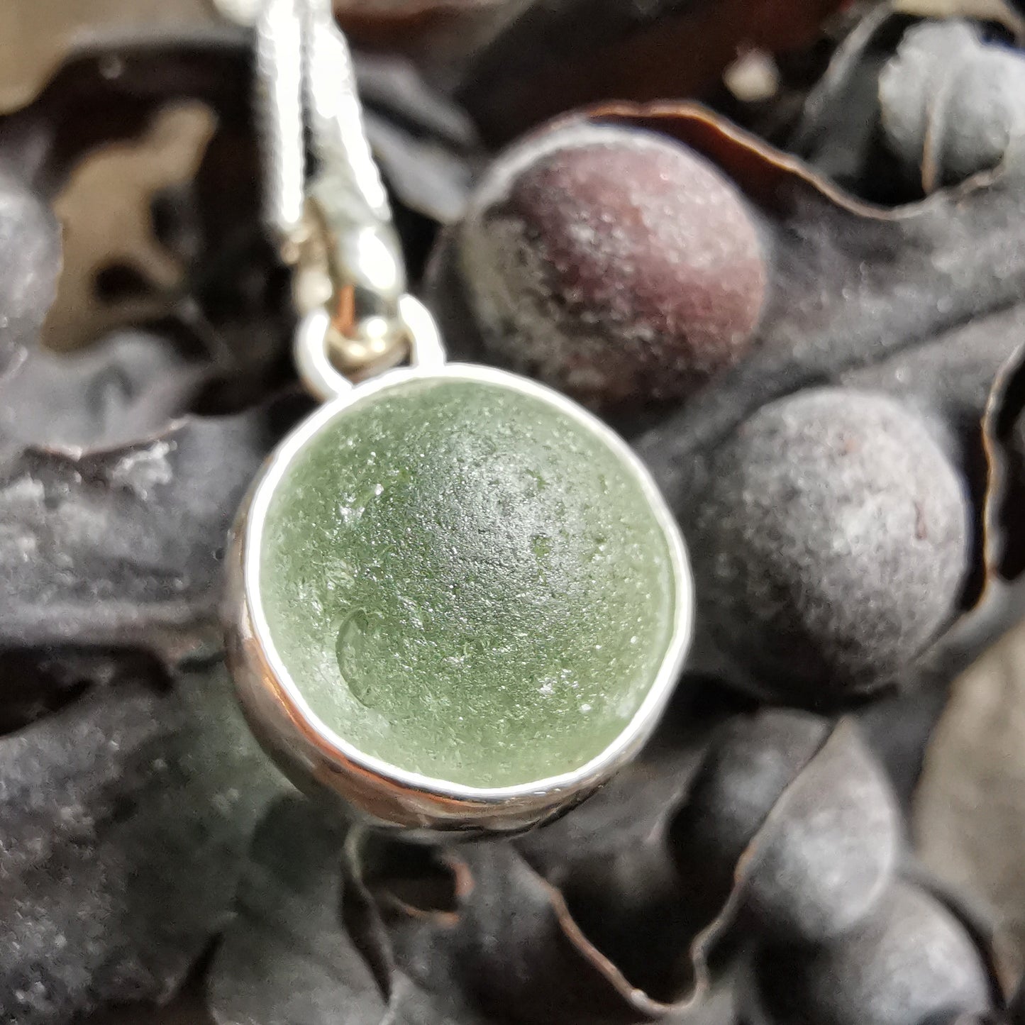 Genuine tiny Scottish Codd sea glass marble & sterling silver pendant.