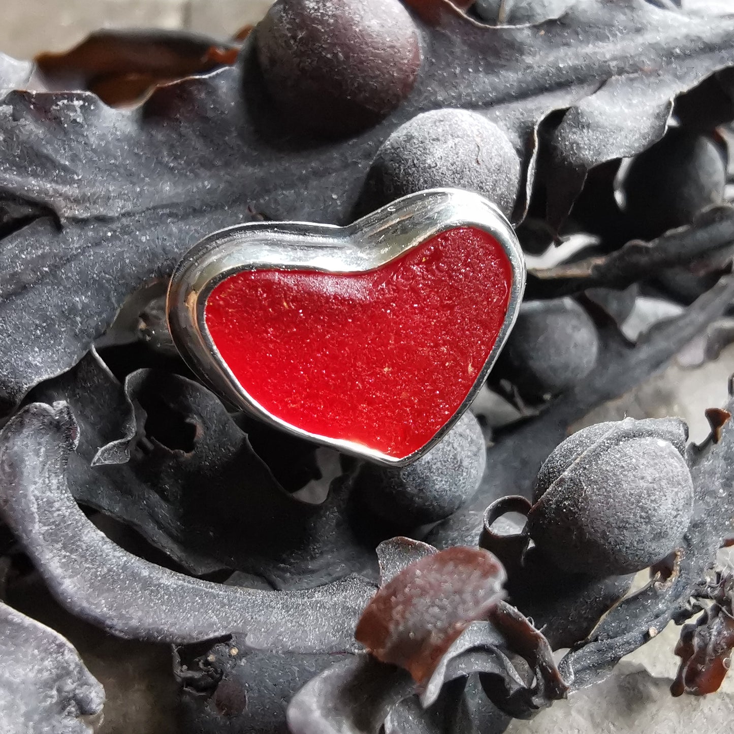 Red UV sea glass heart & sterling silver adjustable ring.