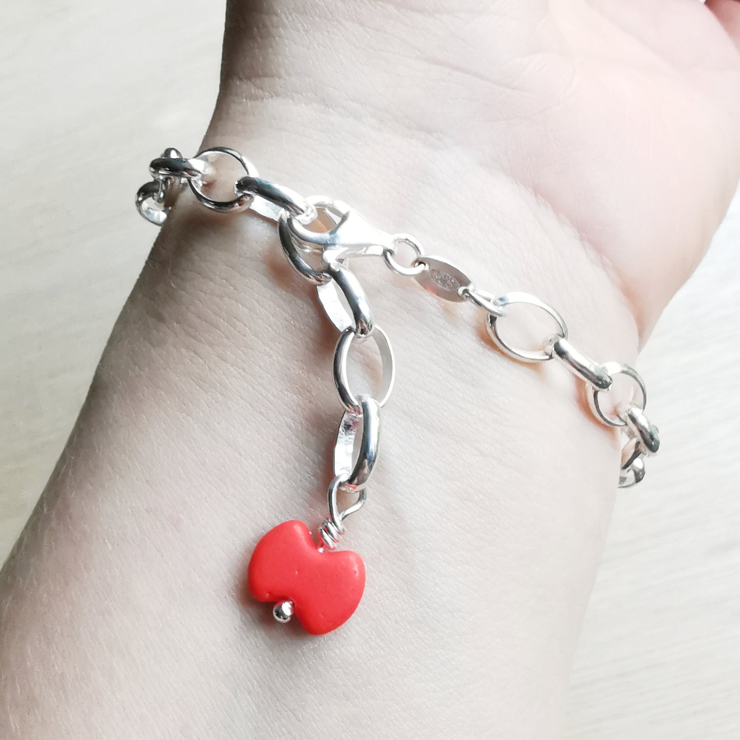 Blue sea glass heart & sterling silver bracelet.