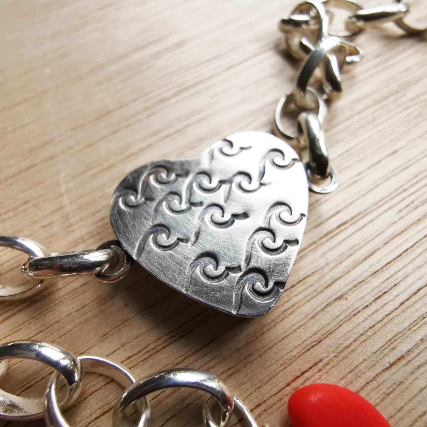 Blue sea glass heart & sterling silver bracelet.