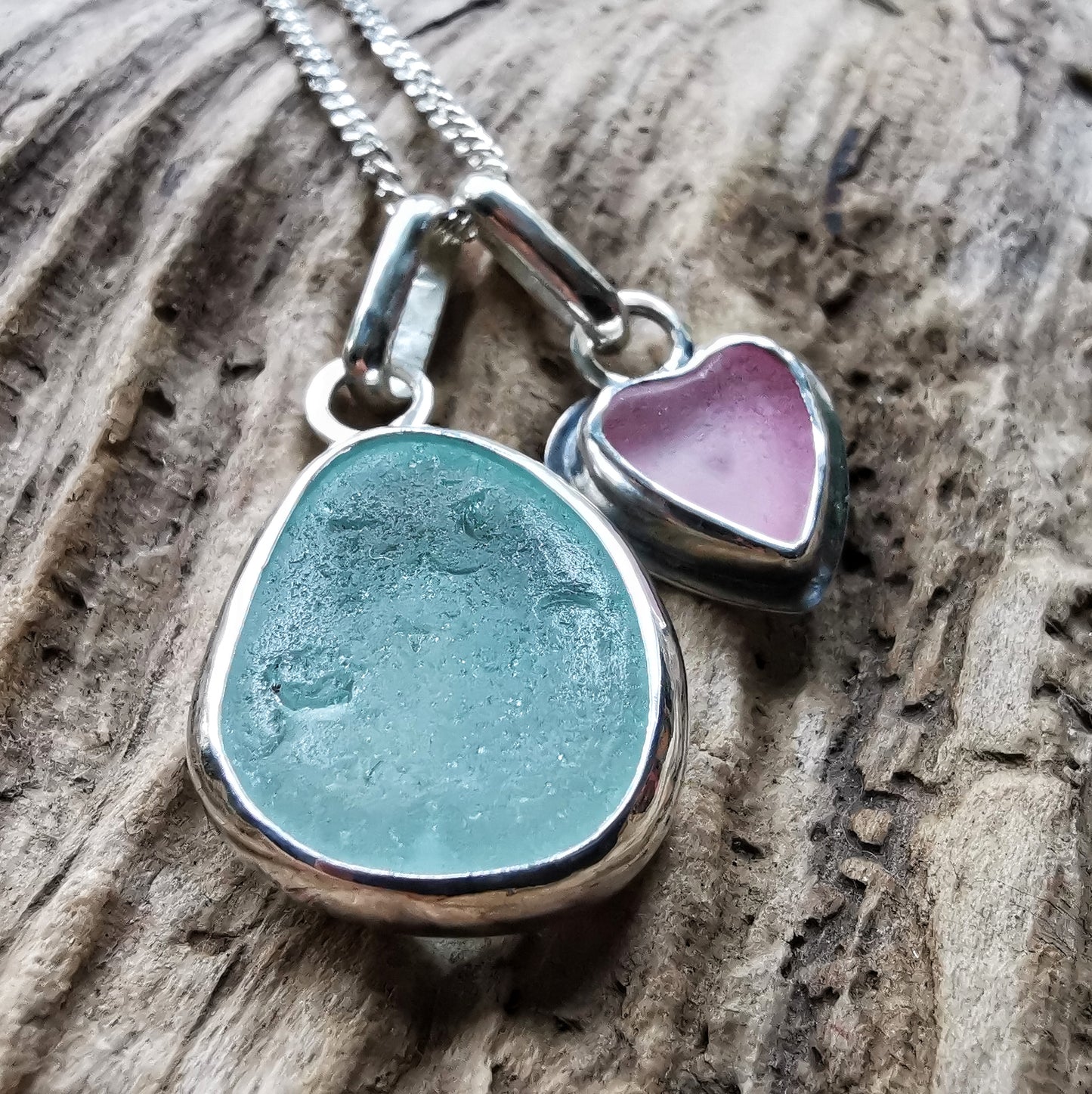 Tiny Scottish pink sea glass heart and light teal blue duo pendants in sterling silver.