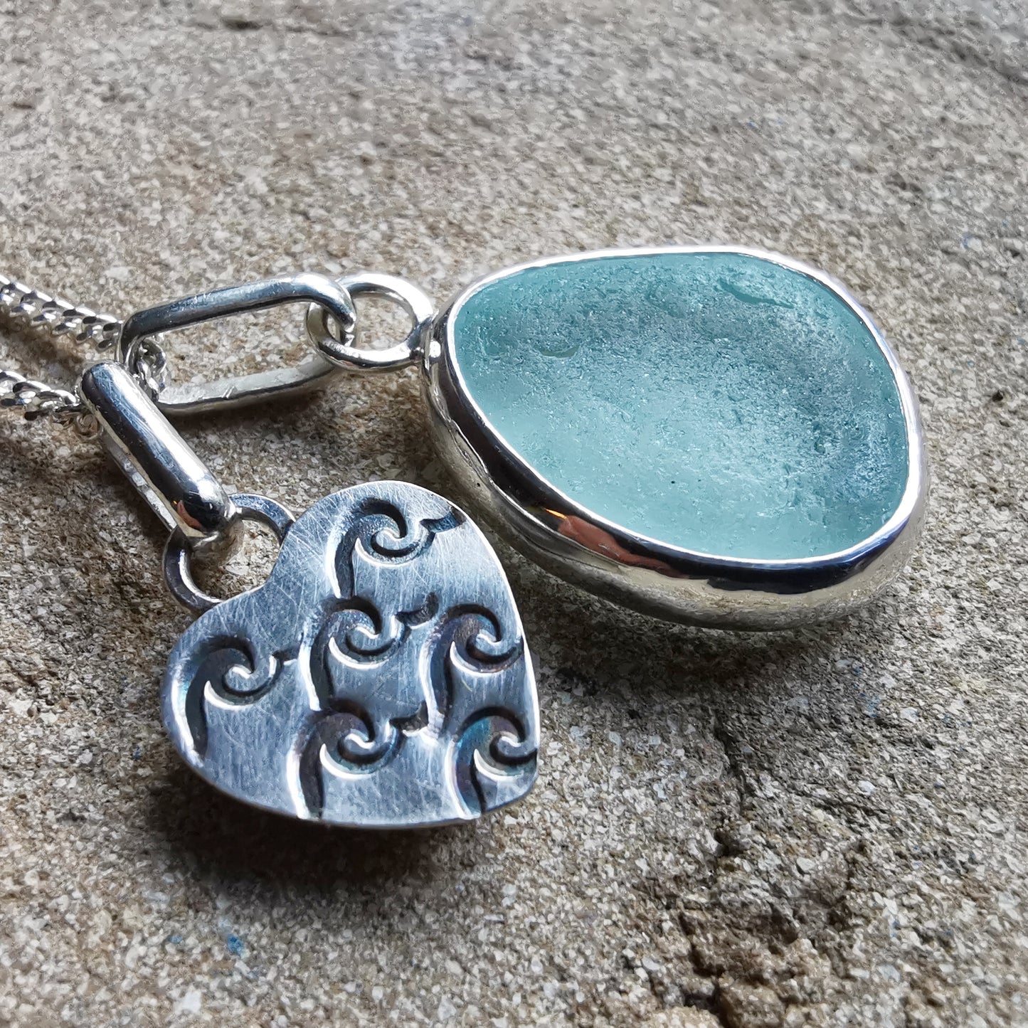 Tiny Scottish pink sea glass heart and light teal blue duo pendants in sterling silver.