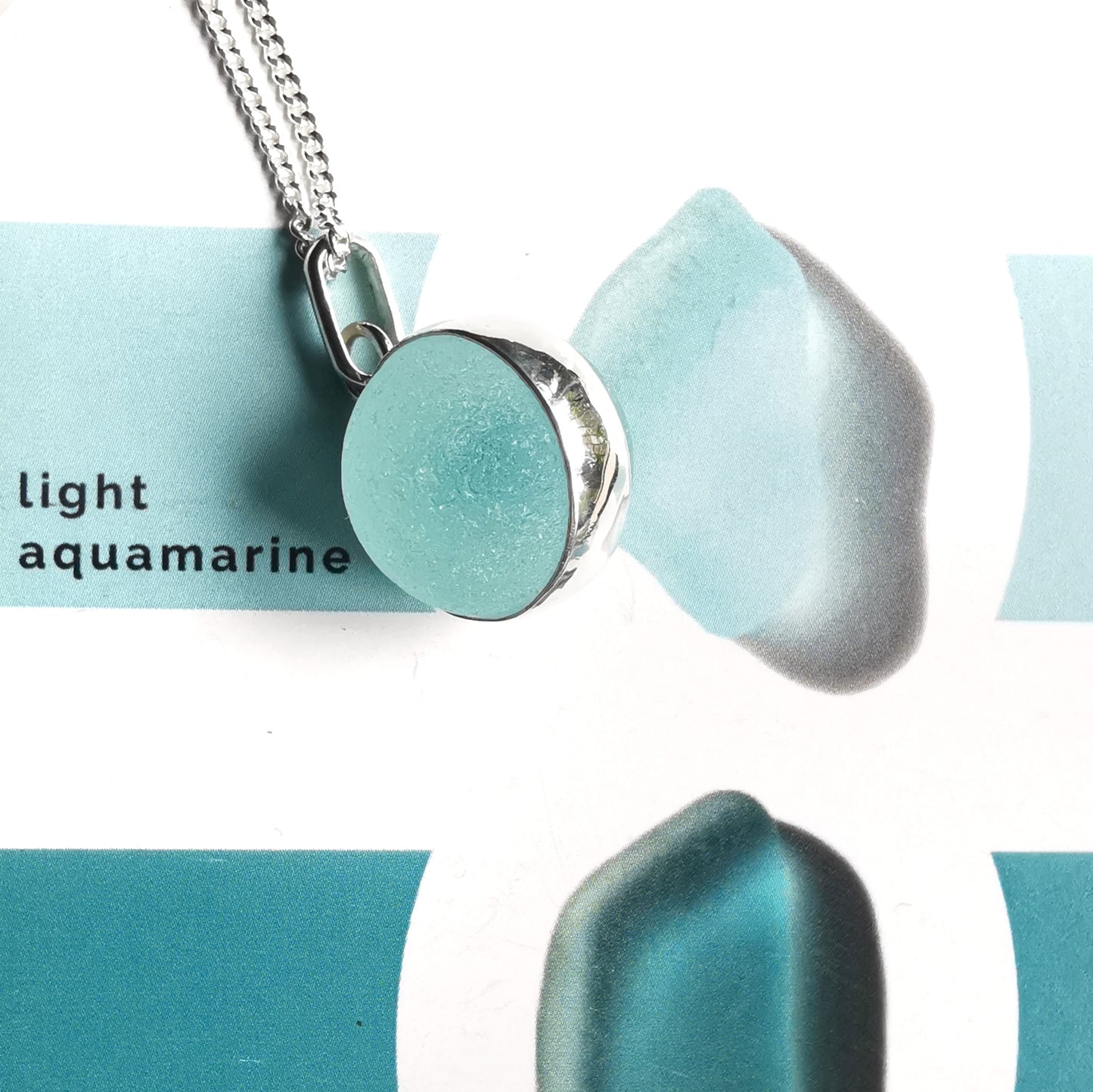 Scottish light aqua blue sea glass marble & sterling silver pendant.