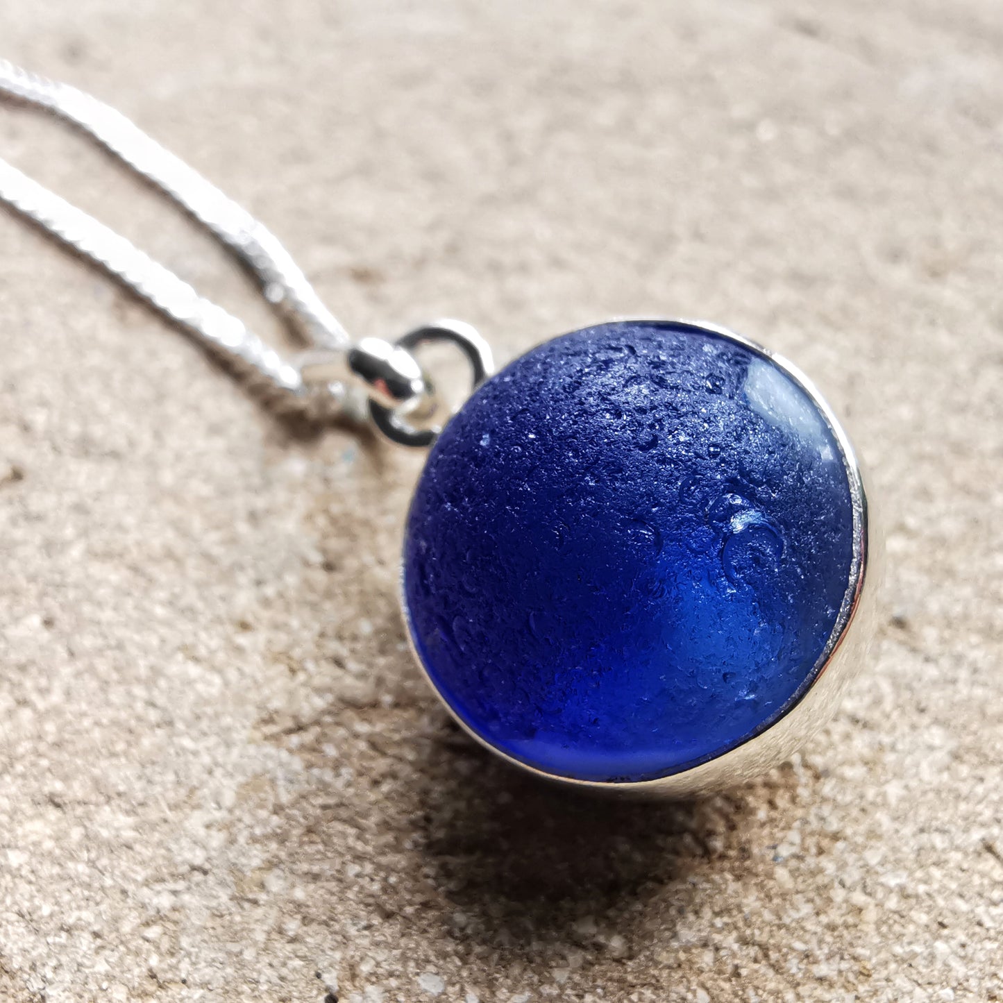 Scottish cobalt blue and white sea glass marble & sterling silver pendant.