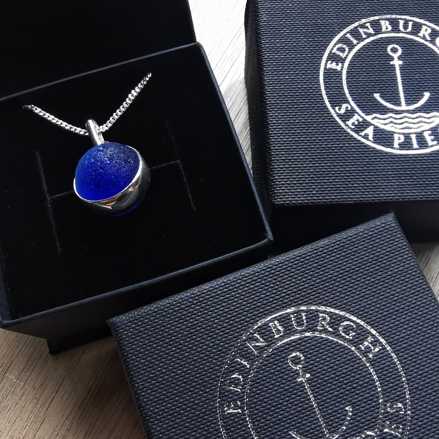 Scottish cobalt blue and white sea glass marble & sterling silver pendant.