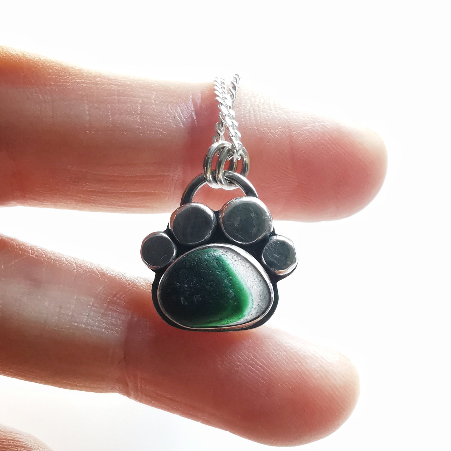 Seaham green and clear multi sea glass & sterling silver paw pendant.