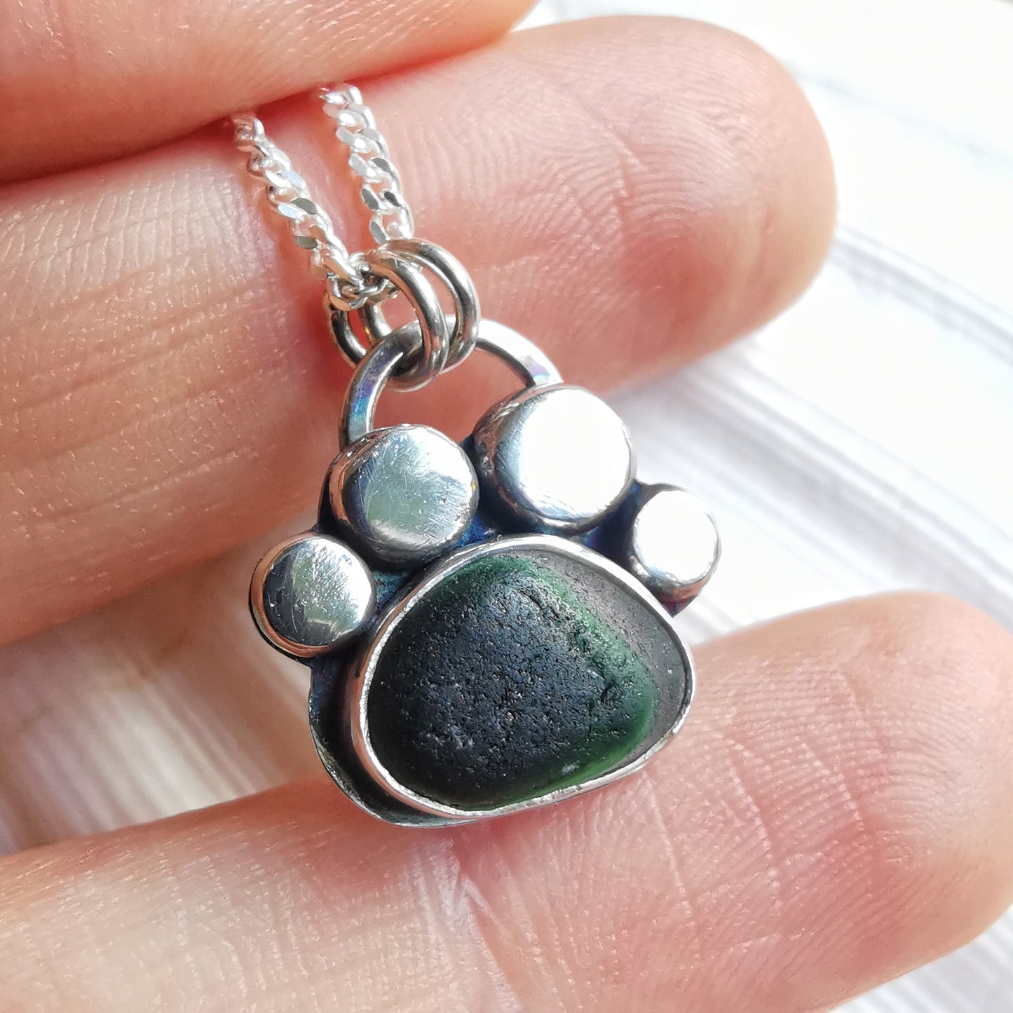 Seaham green and clear multi sea glass & sterling silver paw pendant.