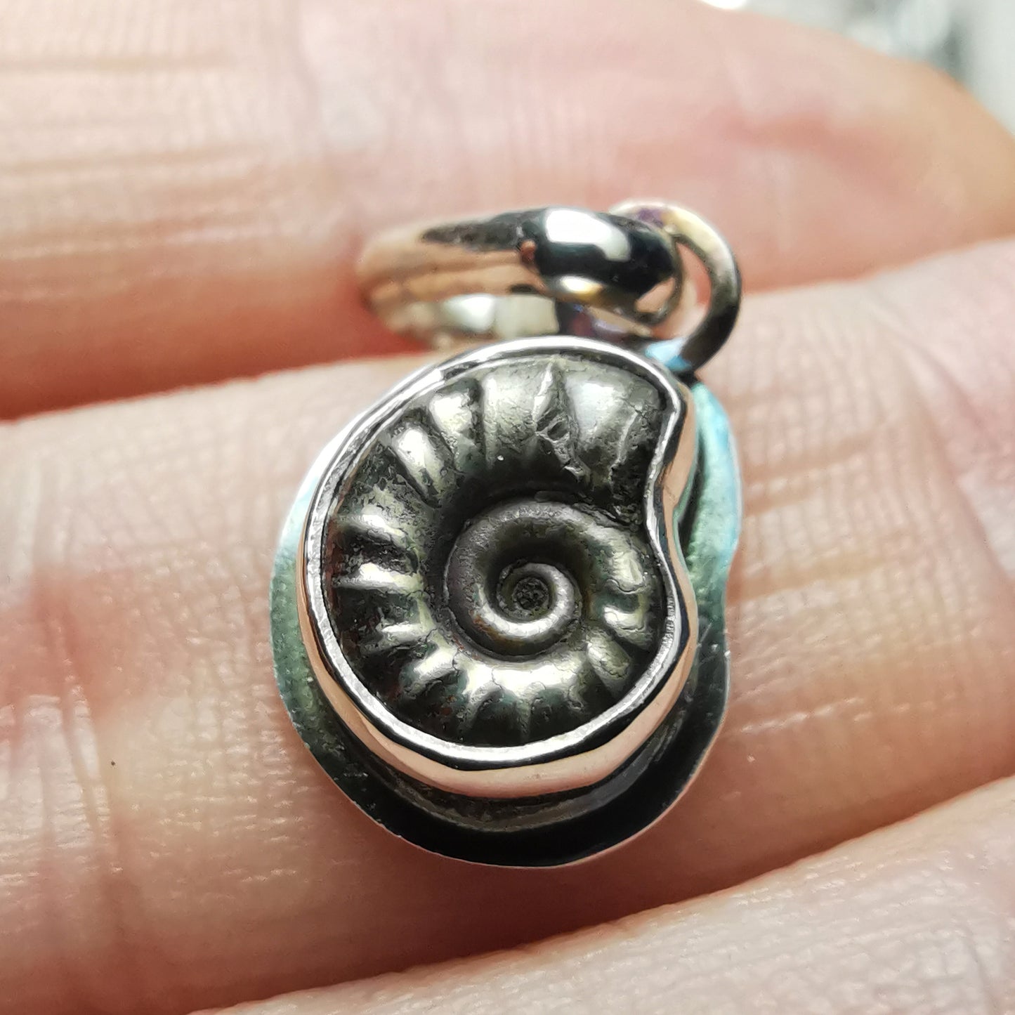 Tiny ammonite fossil & sterling silver pendant.