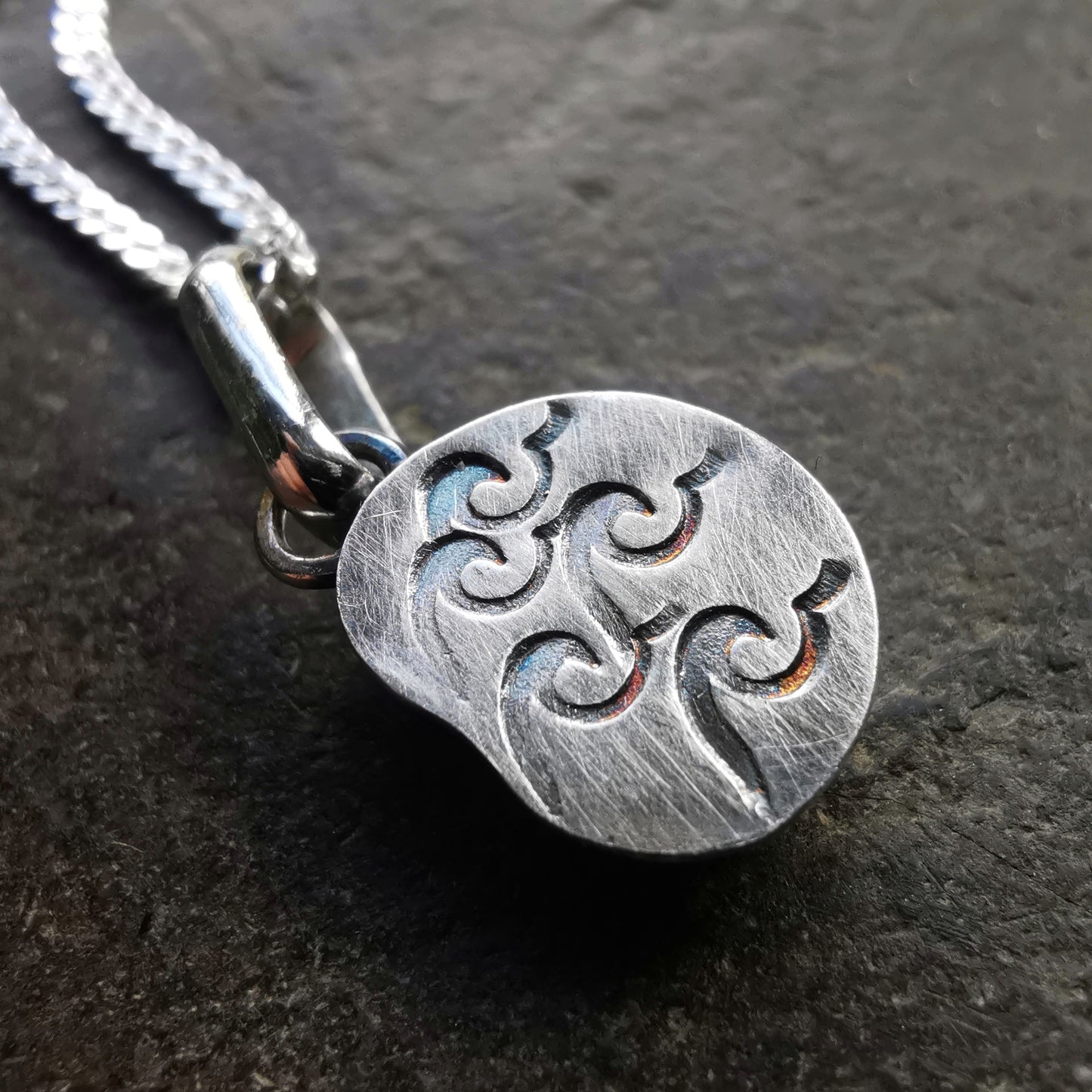 Tiny ammonite fossil & sterling silver pendant.