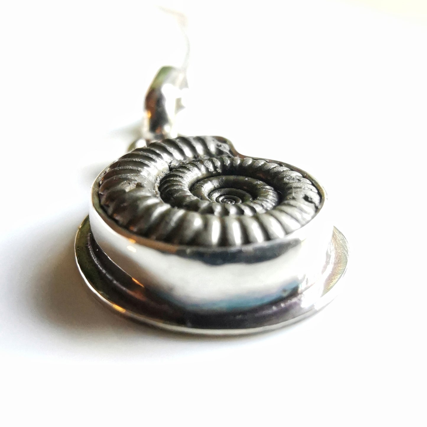 Ammonite fossil & sterling silver pendant.