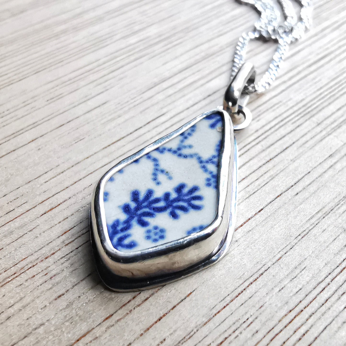 Scottish blue and white seaweed pattern sea pottery & sterling silver pendant.