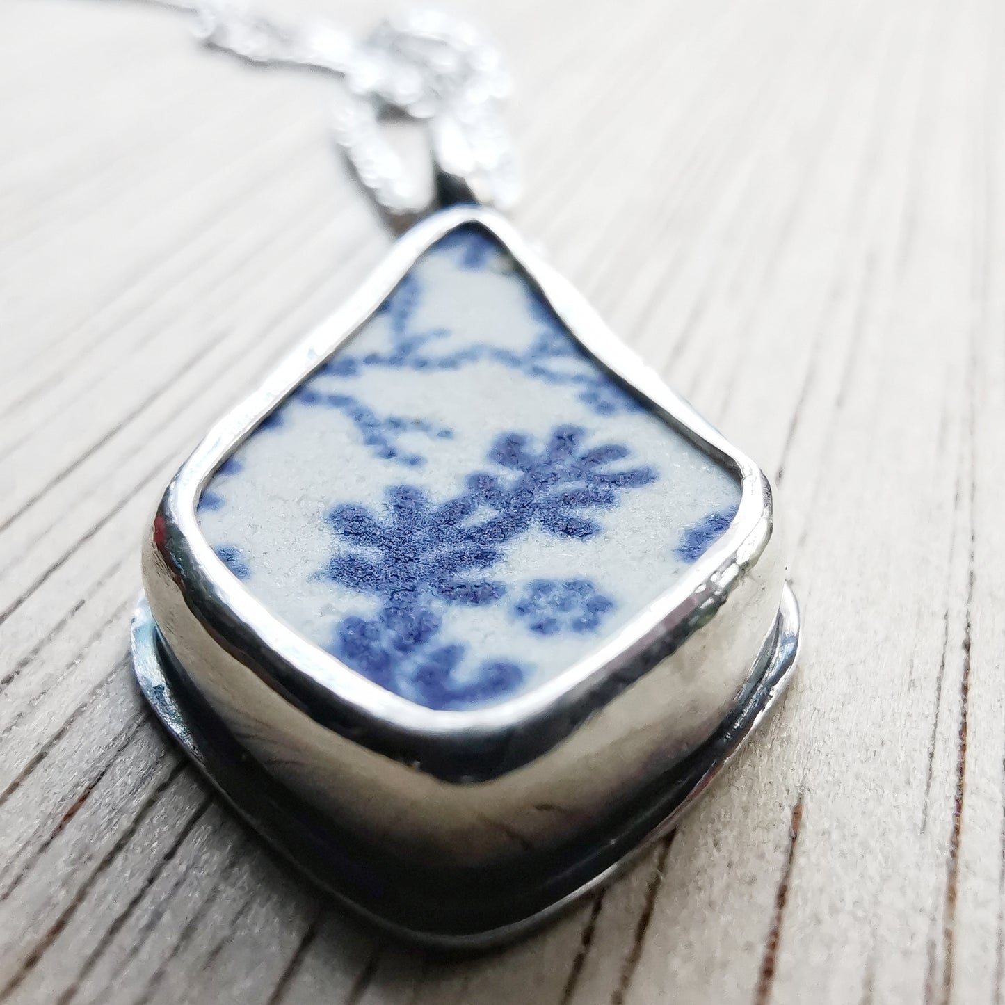 Scottish blue and white seaweed pattern sea pottery & sterling silver pendant.