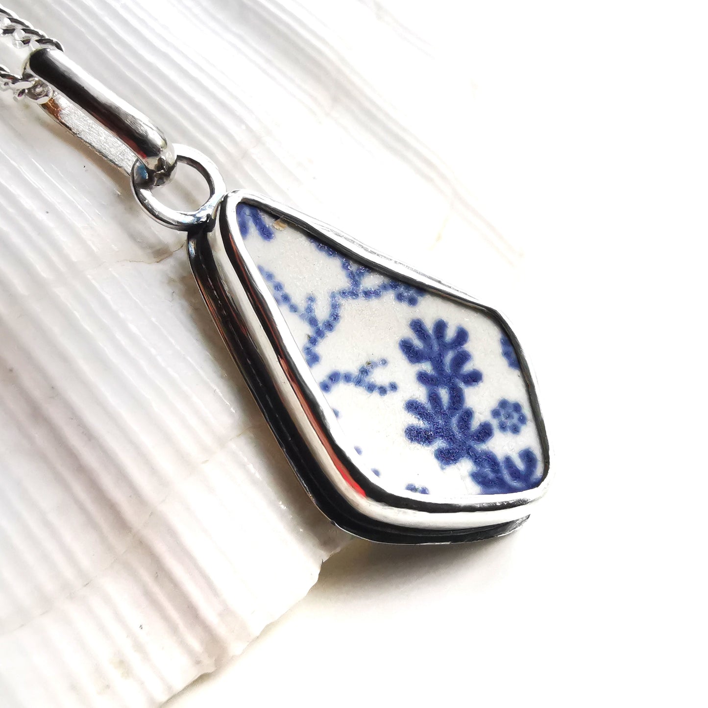 Scottish blue and white seaweed pattern sea pottery & sterling silver pendant.