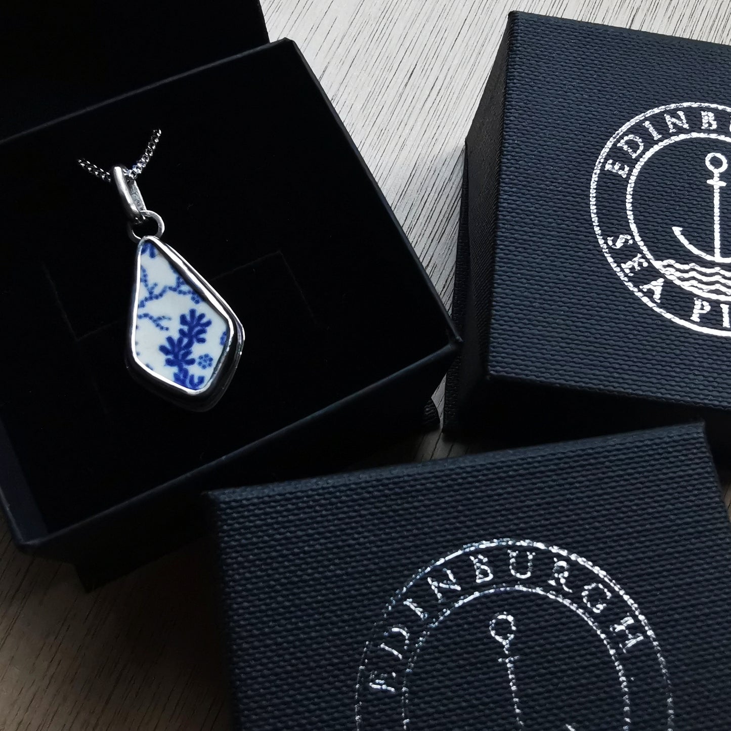 Scottish blue and white seaweed pattern sea pottery & sterling silver pendant.