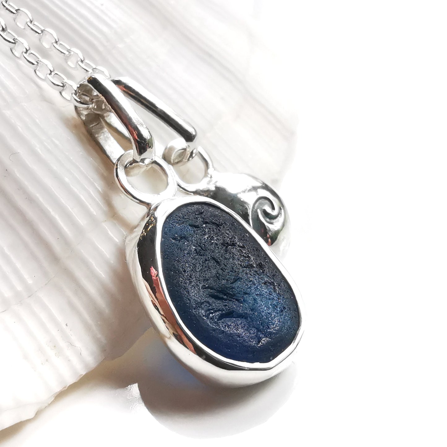 Seaham blue sea glass and silver wave pebble duo of pendants.