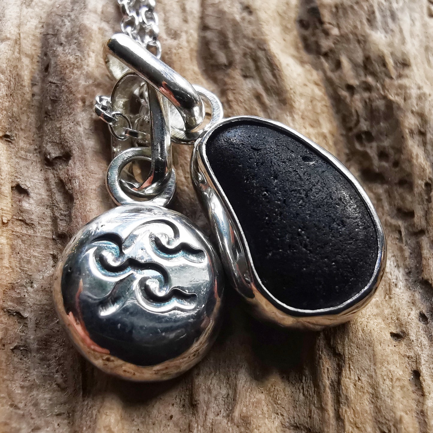 Black/purple Seaham sea glass pendant and sterling silver wave pebble duo.