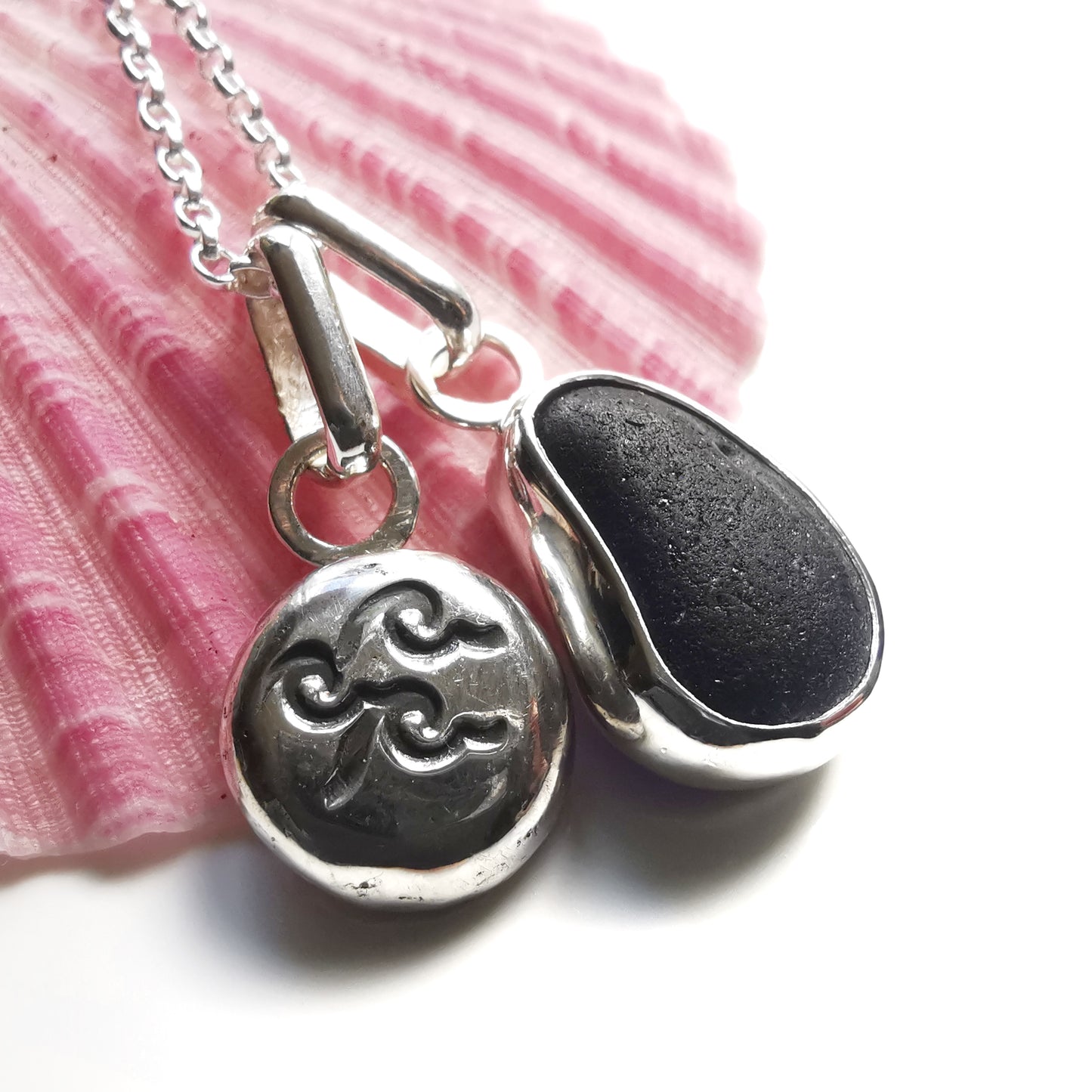 Black/purple Seaham sea glass pendant and sterling silver wave pebble duo.