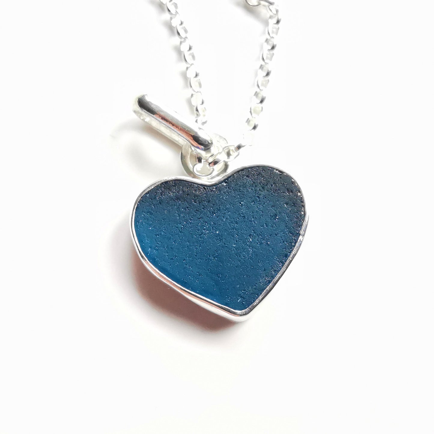 Reserved. Scottish teal blue sea glass heart & sterling silver pendant.