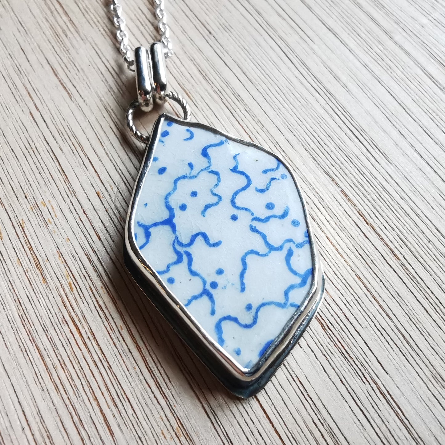 Scottish blue and white sea pottery & sterling silver pendant.