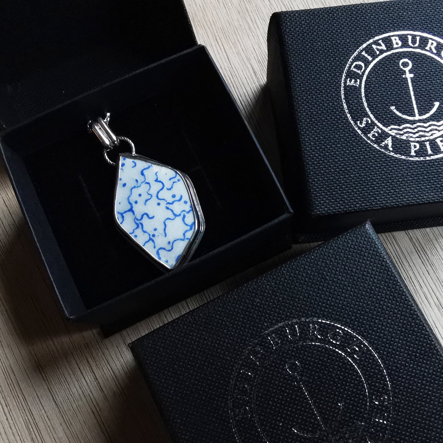 Scottish blue and white sea pottery & sterling silver pendant.