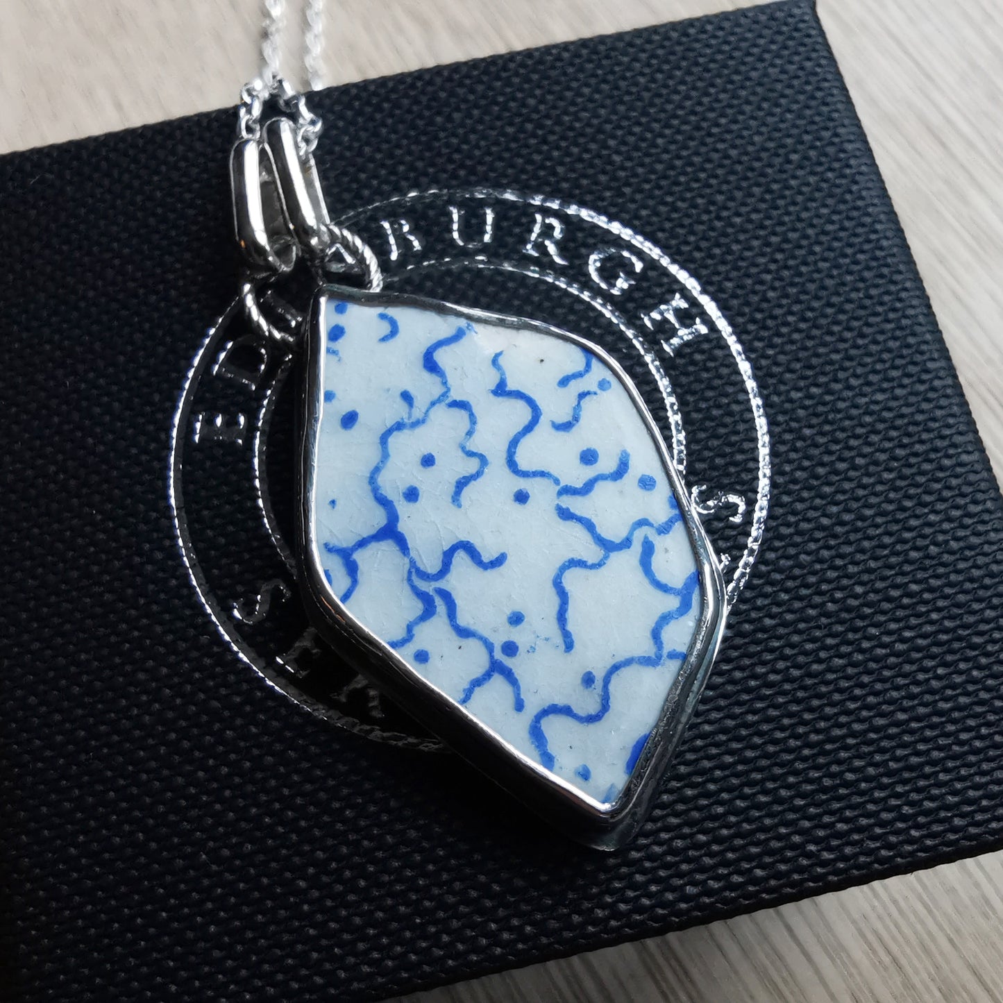 Scottish blue and white sea pottery & sterling silver pendant.