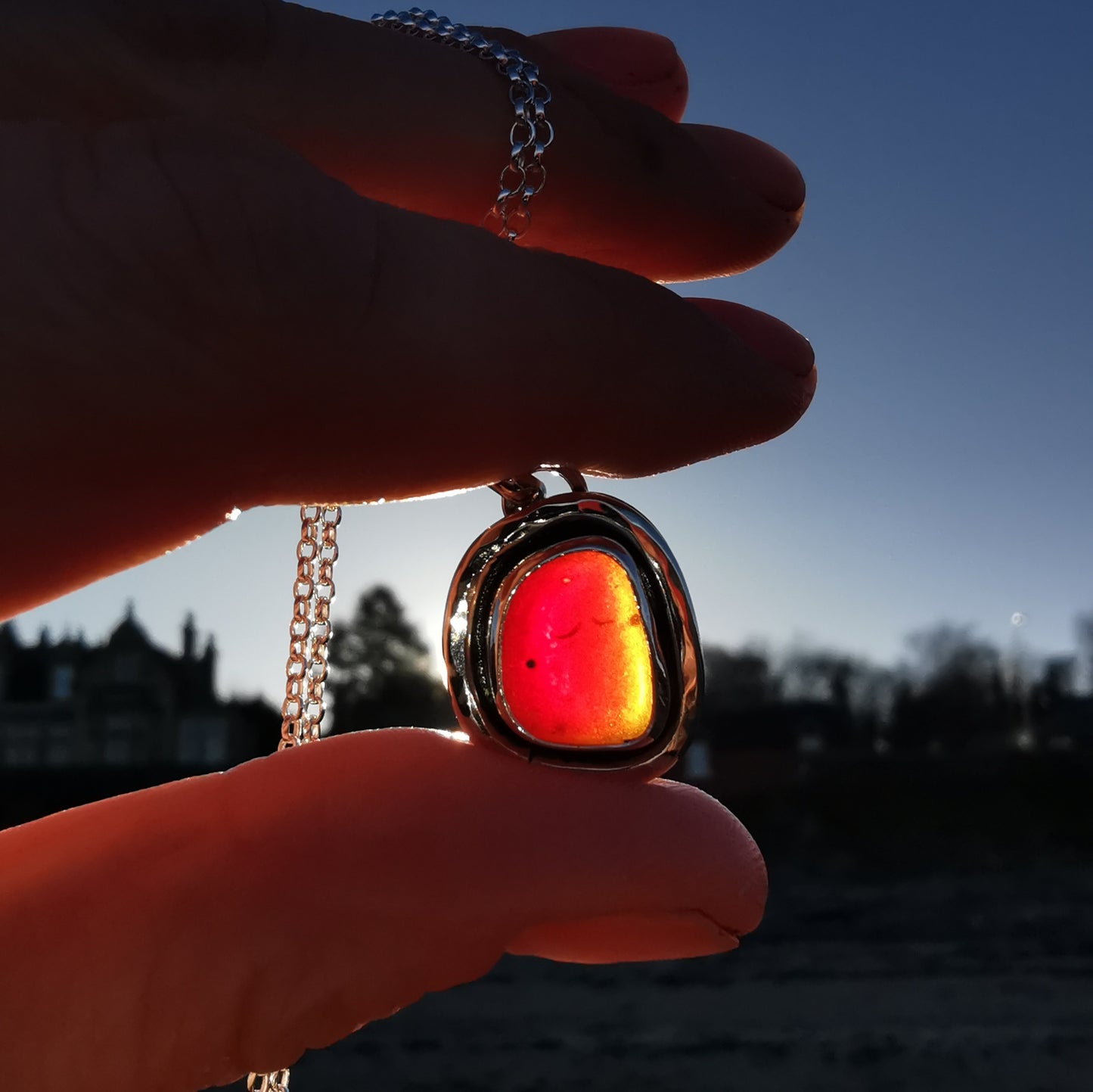 Red amberina sea glass & sterling silver pendant.