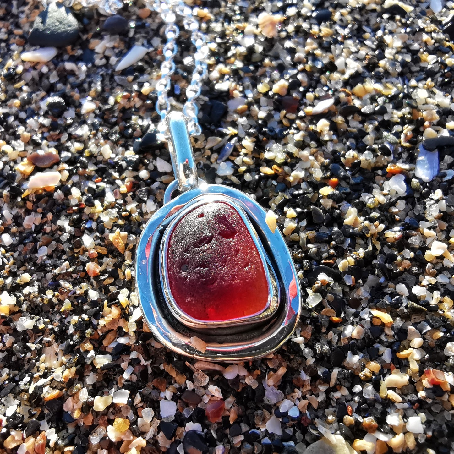 Red amberina sea glass & sterling silver pendant.