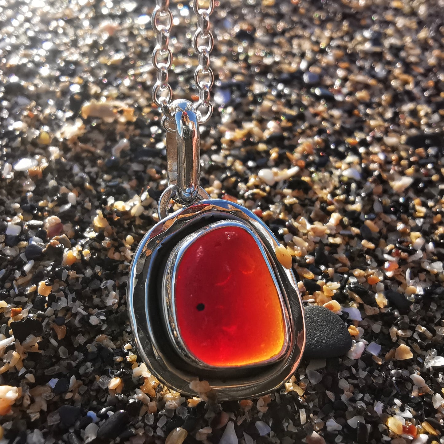 Red amberina sea glass & sterling silver pendant.