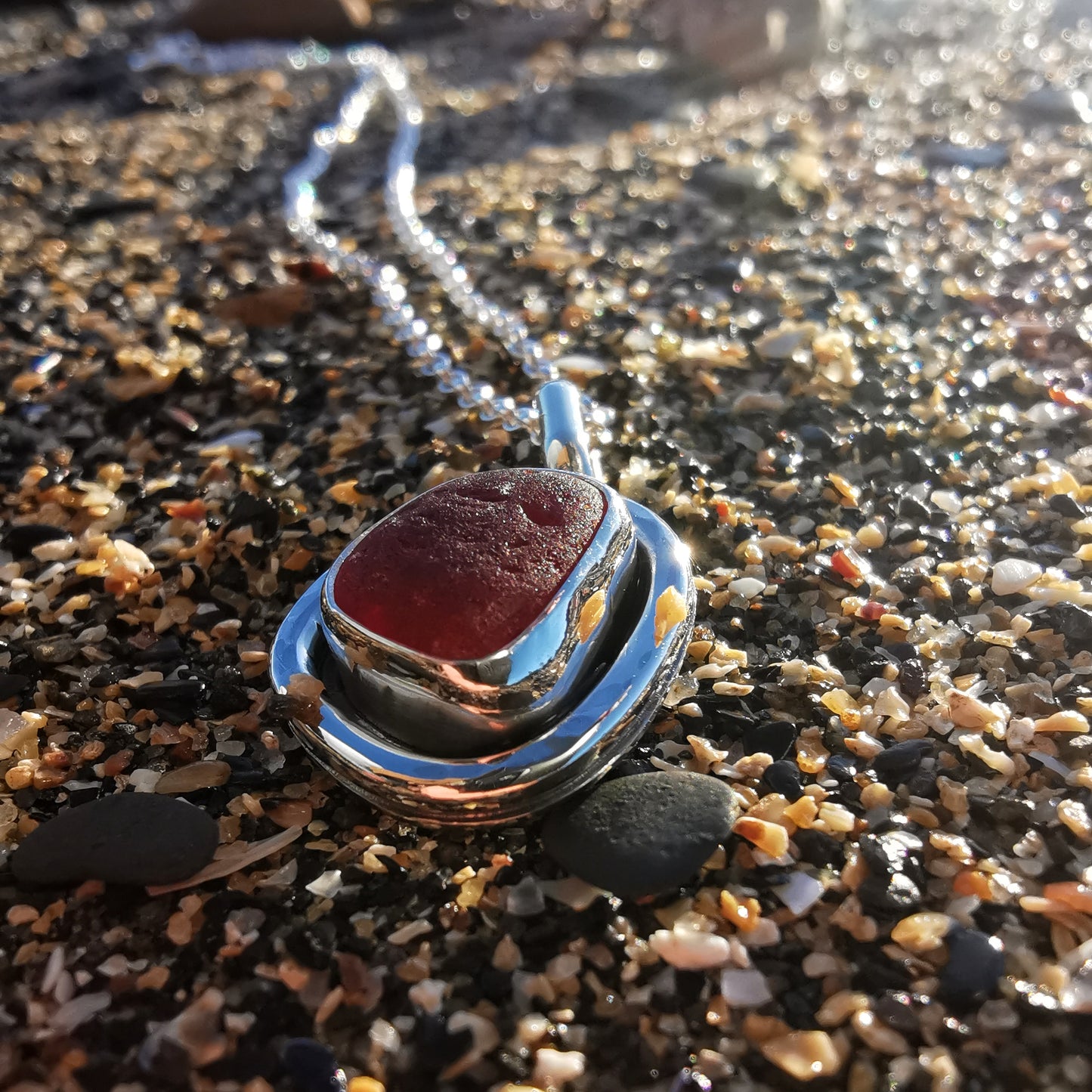 Red amberina sea glass & sterling silver pendant.