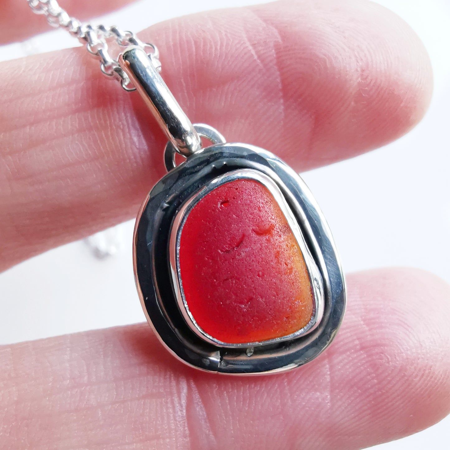 Red amberina sea glass & sterling silver pendant.