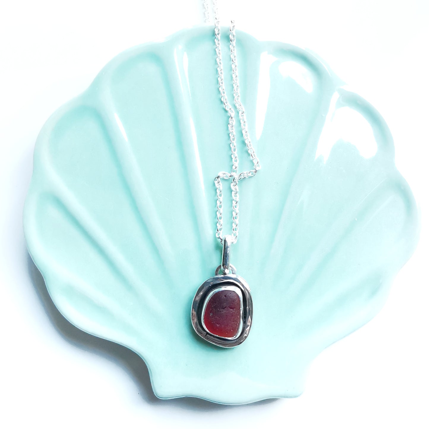 Red amberina sea glass & sterling silver pendant.