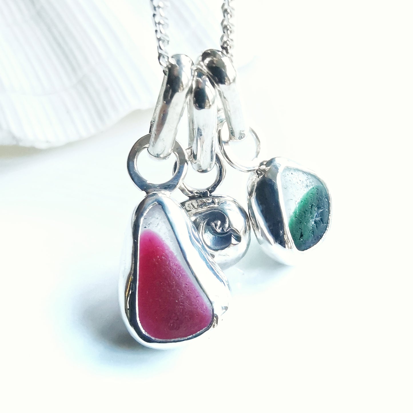 Tiny Seaham pink and green sea glass charms & sterling silver wave pebble trio.