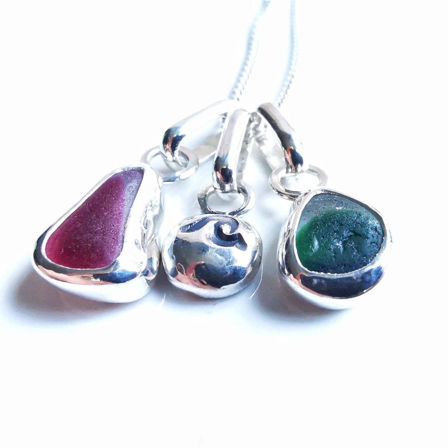 Tiny Seaham pink and green sea glass charms & sterling silver wave pebble trio.