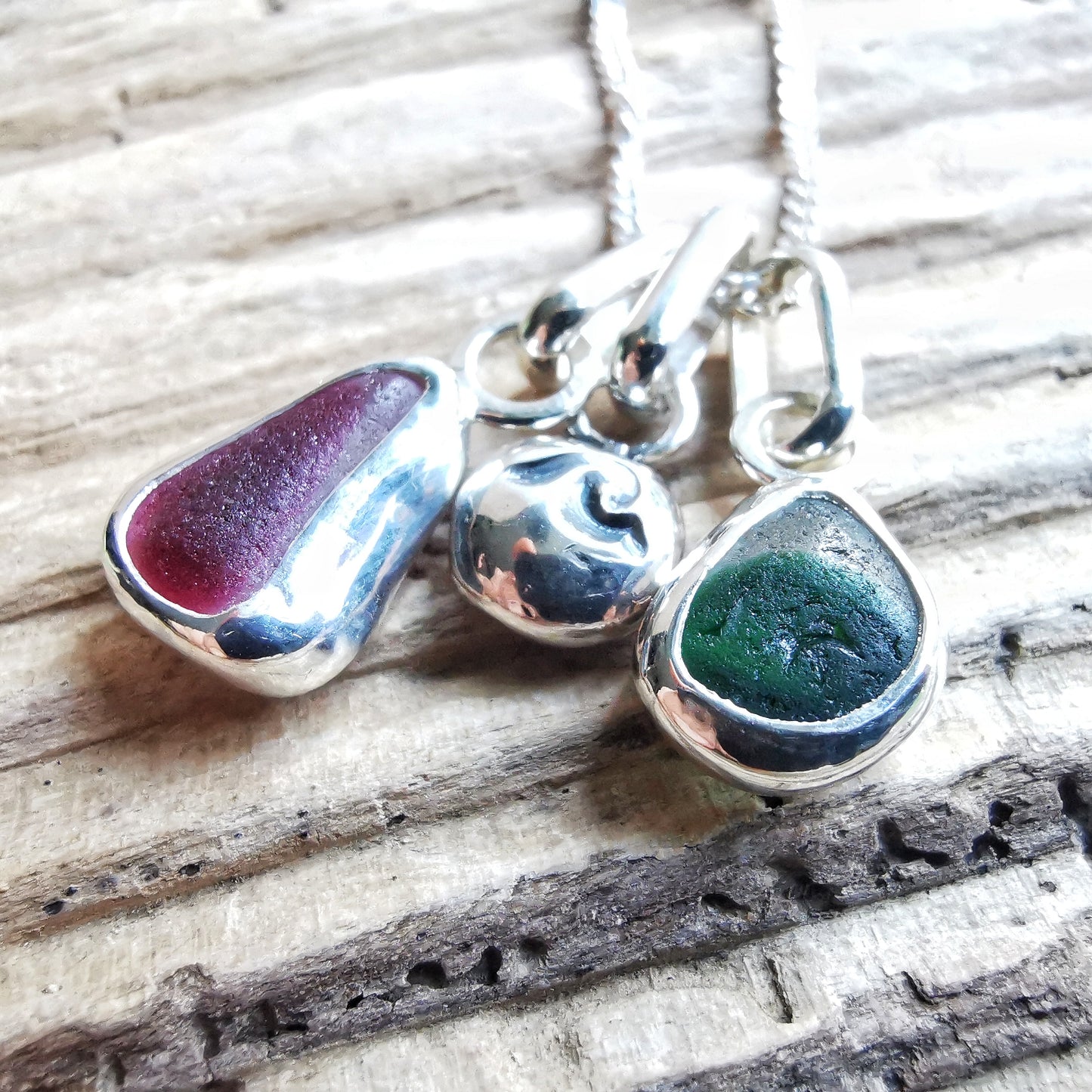 Tiny Seaham pink and green sea glass charms & sterling silver wave pebble trio.