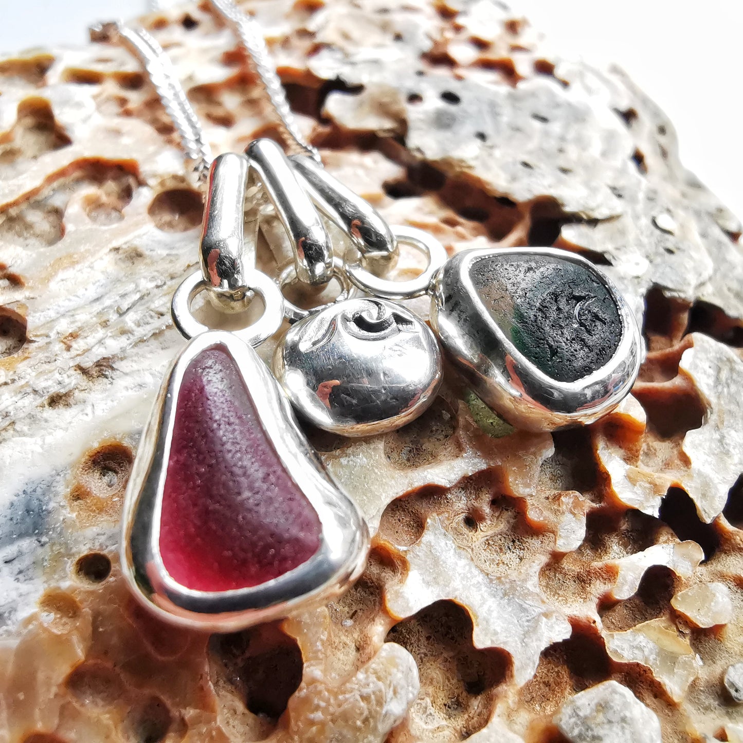 Tiny Seaham pink and green sea glass charms & sterling silver wave pebble trio.