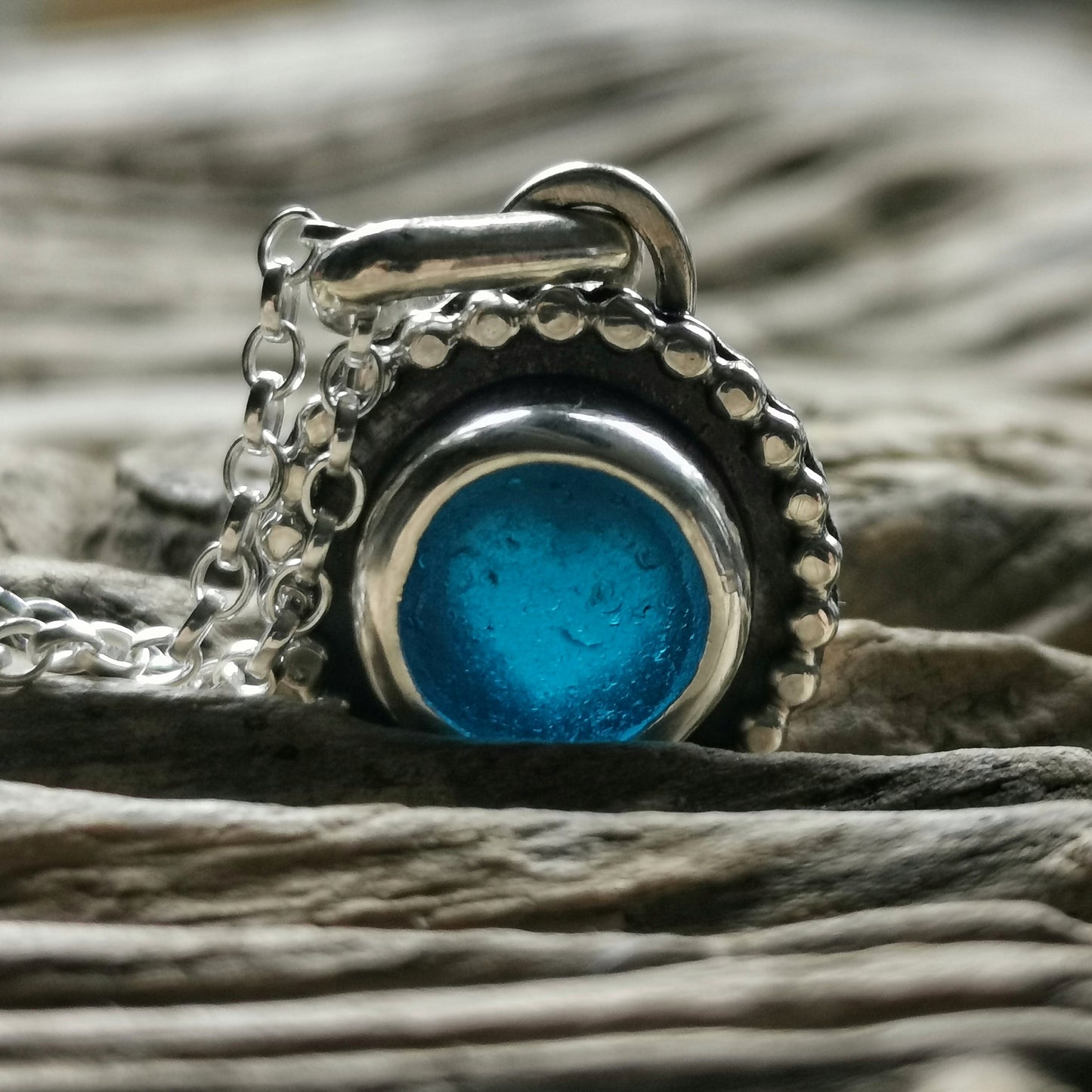 Electric blue sea glass & sterling silver pendant.